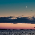 Sunset with new moon over Macamic Lake