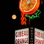 Moon rising against the Orange Julep sign