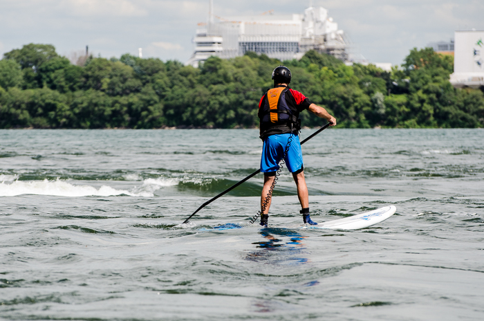 Paddle boarder approaches the rapids